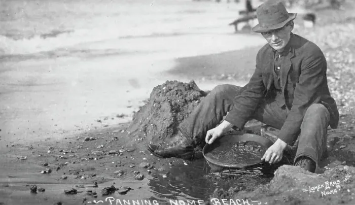 Framed Print : Man panning gold on Nome Beach, between c1900 and c1930. Creator: Lomen Brothers Framed Print : Man panning gold on Nome Beach, between c1900 and c1930. Creator: Lomen Brothers