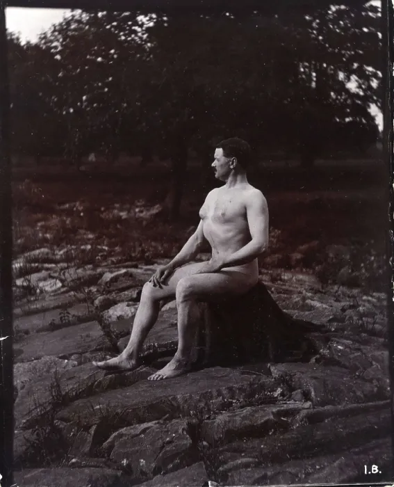 Framed Print : A man posing naked, seated on a rocky outcrop in a leafy landscape, c1900. Creator: Unknown Framed Print : A man posing naked, seated on a rocky outcrop in a leafy landscape, c1900. Creator: Unknown