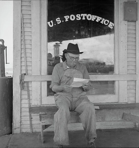 Man in front of post office, Carey, Texas, 1937. Creator: Dorothea Lange
