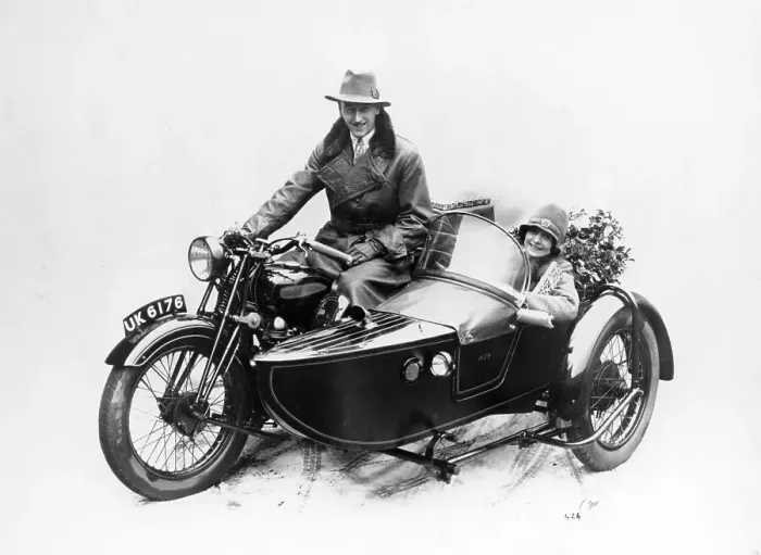 Framed Print : Man riding an AJS motorbike with a woman in the sidecar, 1939 Framed Print : Man riding an AJS motorbike with a woman in the sidecar, 1939