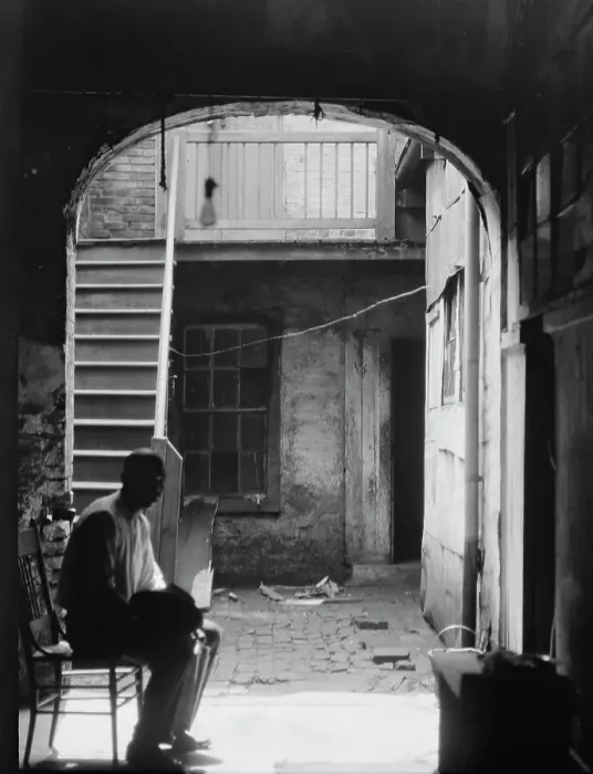 Framed Print : Man seated in archway leading to a courtyard, New Orleans, between 1920 and 1926. Creator: Arnold Genthe Framed Print : Man seated in archway leading to a courtyard, New Orleans, between 1920 and 1926. Creator: Arnold Genthe