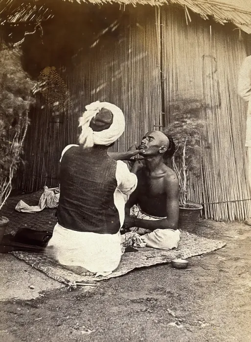 Framed Print : Man being shaved in one of the hospital camps, during the outbreak of bubonic plague... 1897. Creator: Unknown Framed Print : Man being shaved in one of the hospital camps, during the outbreak of bubonic plague... 1897. Creator: Unknown