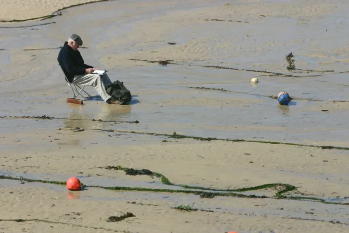 Framed Print : Man sitting on the sand in St Ives harbour at low tide, Cornwall Framed Print : Man sitting on the sand in St Ives harbour at low tide, Cornwall