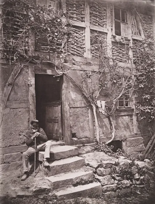 Framed Print : [Man Sitting on Steps of House with Socks Hanging on Nearby Vine to Dry], 1880s