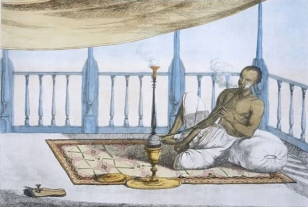 Man smoking a hookah of hashish or opium, pub. 1808-12. Creator: Franz Balthazar Solvyns