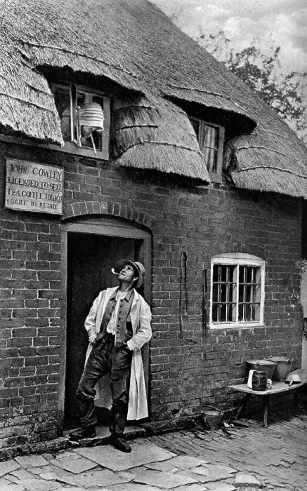 Framed Print : A man smoking a pipe outside a shop, Worcestershire, c1922. Artist: AW Cutler Framed Print : A man smoking a pipe outside a shop, Worcestershire, c1922. Artist: AW Cutler