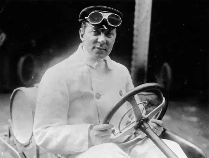 Framed Print : A man at the wheel of his car dressed in a driving coat and goggles Framed Print : A man at the wheel of his car dressed in a driving coat and goggles