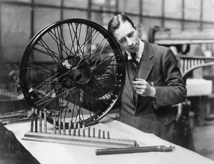 Framed Print : A man in a workshop with a wheel Framed Print : A man in a workshop with a wheel