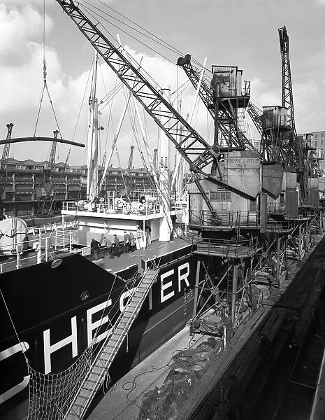 The Manchester Renown being loaded with steel for export, Manchester, 1964. Artist
