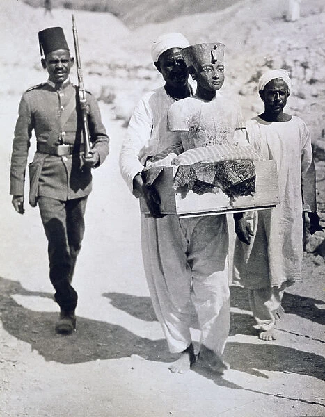 Mannequin or bust of Tutankhamun being carried from his tomb, Valley of the Kings, Egypt, 1922