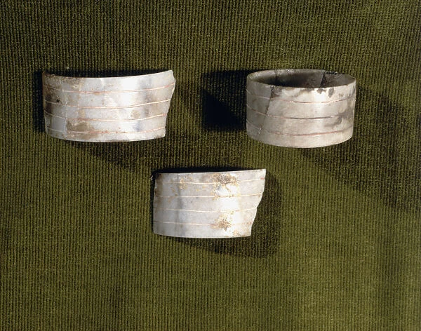 Marble bracelets decorated with parallel carved lines, from the Bat Cave, Zuheros (Cordoba)