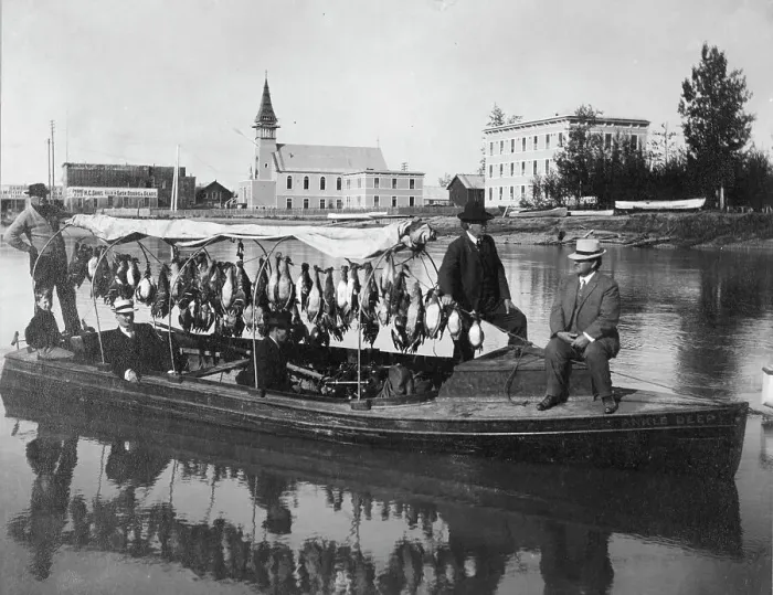 Framed Print : Marshall Erwin in front of a boat containing a kill of ducks, between c1900 and 1927. Creator: Unknown Framed Print : Marshall Erwin in front of a boat containing a kill of ducks, between c1900 and 1927. Creator: Unknown