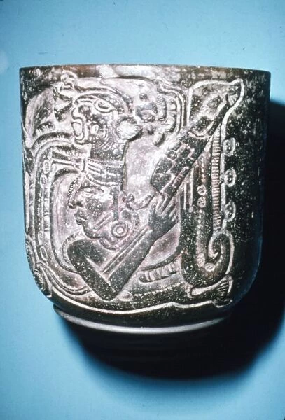 Mayan Pot of Man in high animal head-dress holding staff with lotus flower