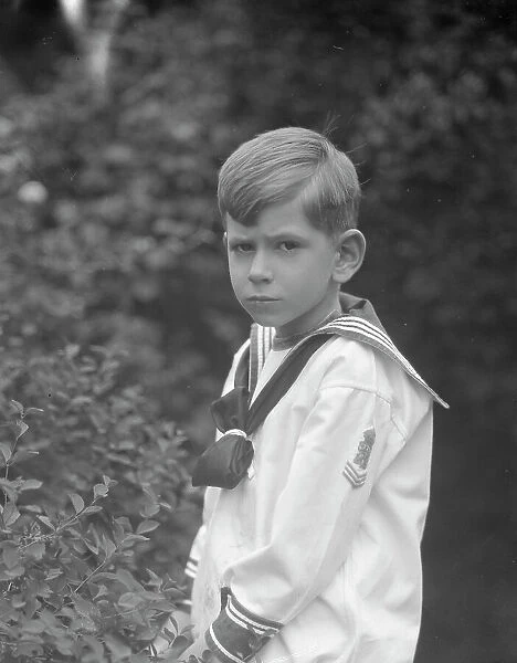 McCormick, Medill, child of, standing outdoors, 1923 May 21. Creator: Arnold Genthe