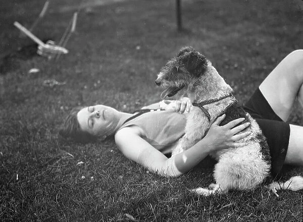 McKeogh, Arthur, Mrs. with dog, outdoors, 1927 Creator: Arnold Genthe