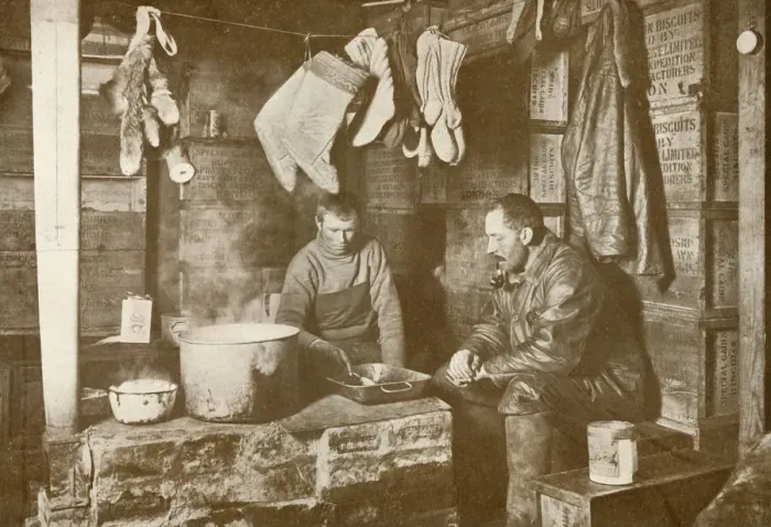 Framed Print : Meares and Demetri at the Blubber Stove in the Discovery Hut, 3 November 1911, (1913) Framed Print : Meares and Demetri at the Blubber Stove in the Discovery Hut, 3 November 1911, (1913)