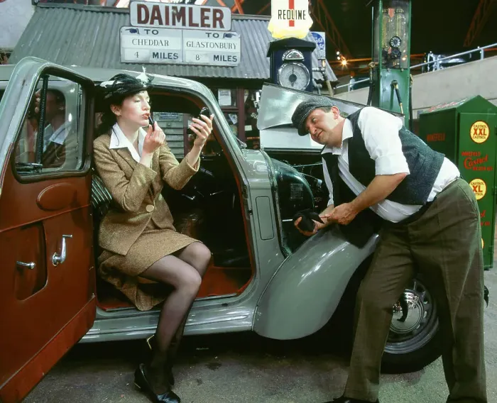 Framed Print : Mechanic with lady driver doing her make up, 1930's Hillman Minx Framed Print : Mechanic with lady driver doing her make up, 1930's Hillman Minx