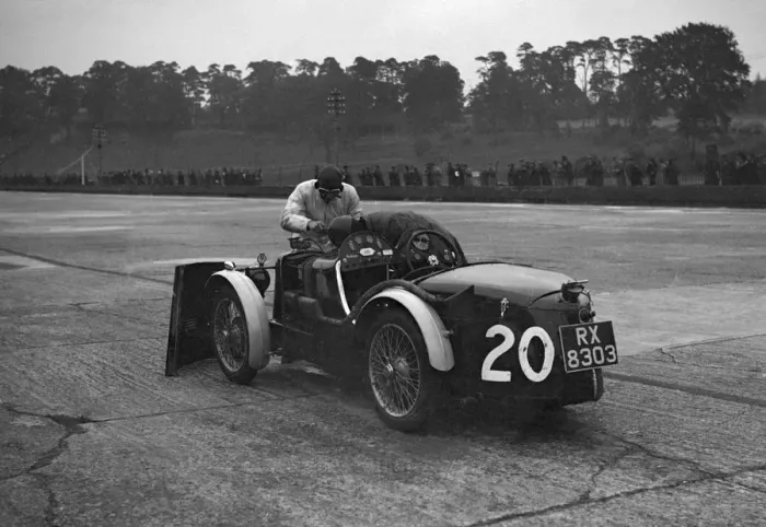Framed Print : Mechanic making adjustments to a MG C type, Brooklands. Artist: Bill Brunell Framed Print : Mechanic making adjustments to a MG C type, Brooklands. Artist: Bill Brunell