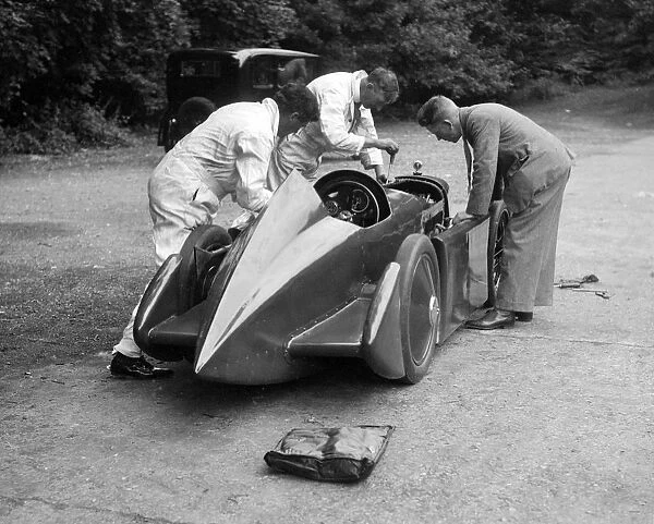 Mechanics working on Leon Cushmans Austin 7 racer for a speed record attempt, Brooklands, 1931