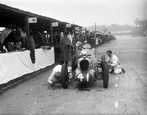 Mechanics working on the MG of Doreen Evans, JCC International Trophy, Brooklands, 1936