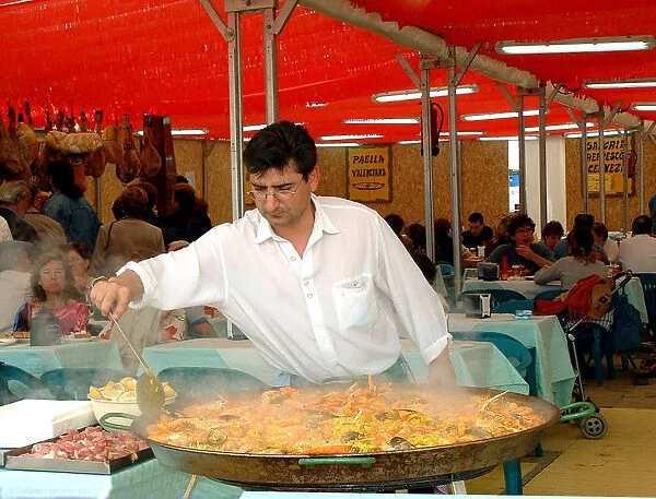 Mediterranean cuisine, chef preparing a paella, Feria de Abril (April Fair) 2002