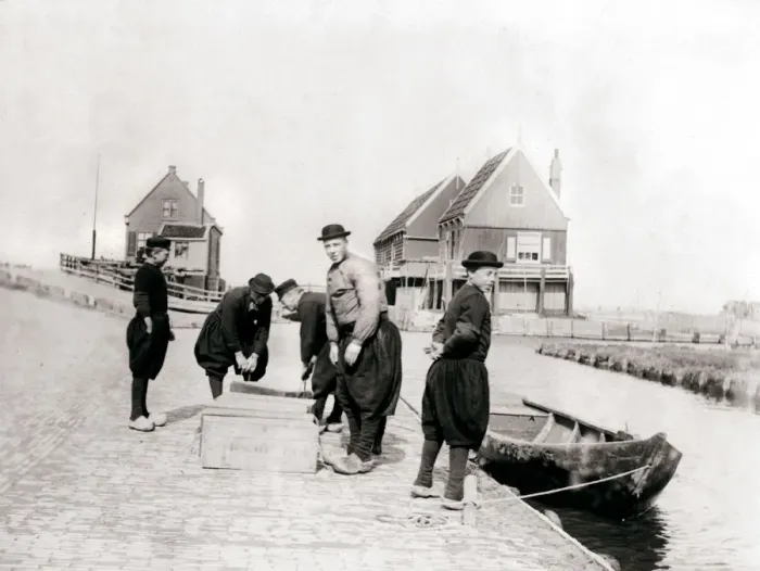 Framed Print : Men and boys in traditional costume by a canal bank, Marken Island, Netherlands, 1898. Artist: James Batkin Framed Print : Men and boys in traditional costume by a canal bank, Marken Island, Netherlands, 1898. Artist: James Batkin