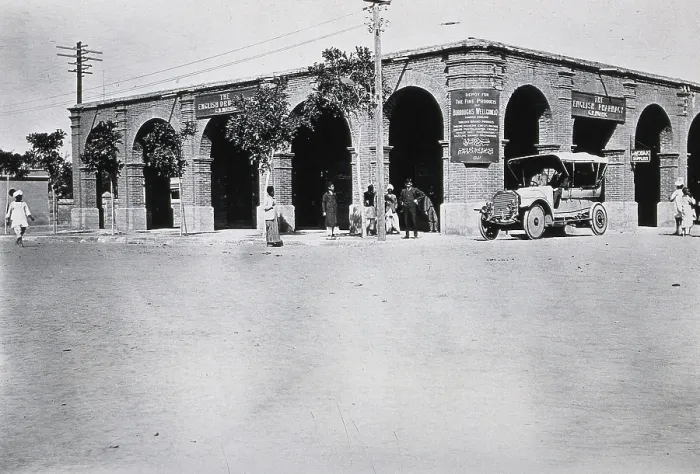 Framed Print : Two men in a car outside the Wellcome pharmaceutical depot in the Middle East, c1910.. Creator: Unknown Framed Print : Two men in a car outside the Wellcome pharmaceutical depot in the Middle East, c1910.. Creator: Unknown