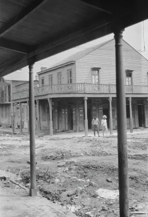 Framed Print : Two men crossing an unpaved street, New Orleans or Charleston, South Carolina, between 1920 and 1926 Creator: Arnold Genthe Framed Print : Two men crossing an unpaved street, New Orleans or Charleston, South Carolina, between 1920 and 1926 Creator: Arnold Genthe