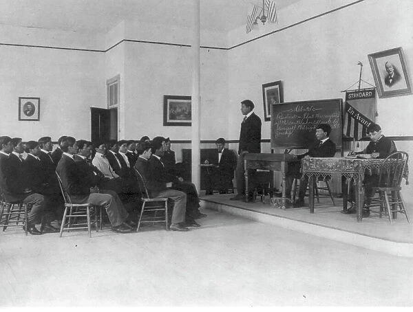 Men debating in class, Carlisle Indian School, Carlisle, Pennsylvania, 1901. Creator: Frances Benjamin Johnston