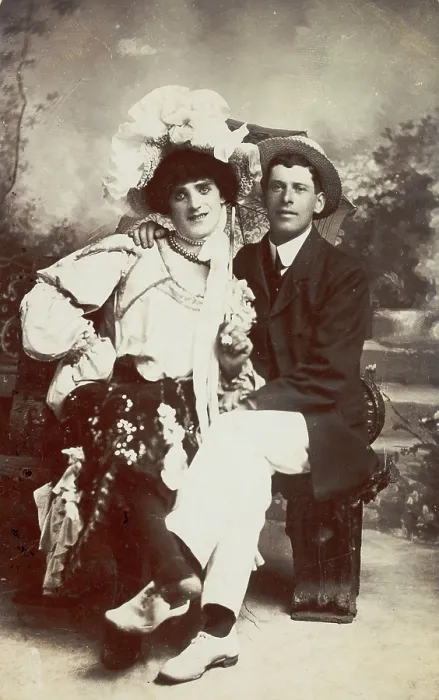 Framed Print : Two men, one in drag, sit together on a bench, (between 1900 and 1901?). Creator: Unknown Framed Print : Two men, one in drag, sit together on a bench, (between 1900 and 1901?). Creator: Unknown