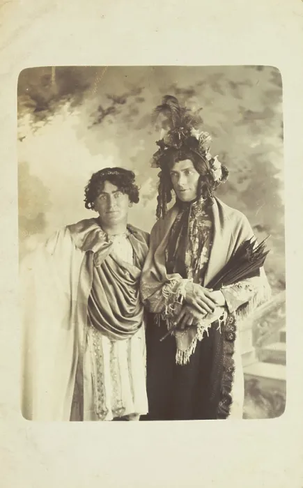 Framed Print : Two men in drag, one wearing a detailed feathered head garment, pose for a portrait, [1900-1909?]. Creator: Frank Wood