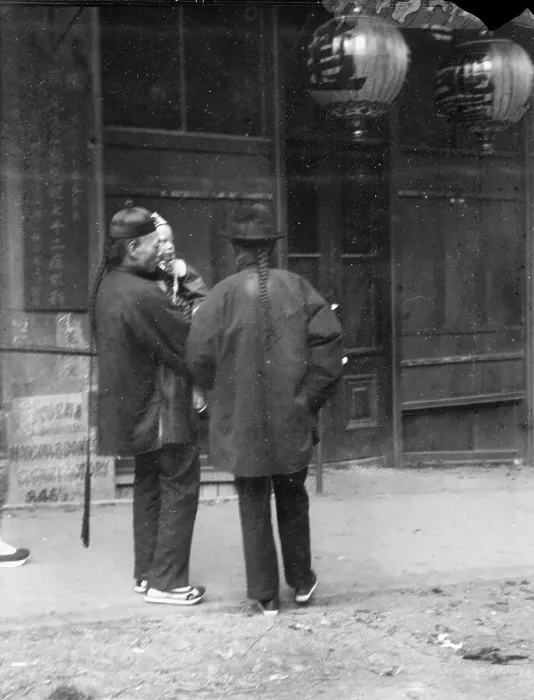 Framed Print : Two men, one holding a child, standing in the street, Chinatown, San Francisco, c1896-1906. Creator: Arnold Genthe Framed Print : Two men, one holding a child, standing in the street, Chinatown, San Francisco, c1896-1906. Creator: Arnold Genthe