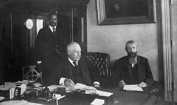 Three men in office in Bureau of Engraving and Printing, Washington, D.C. 1889 or 1890. Creator: Frances Benjamin Johnston
