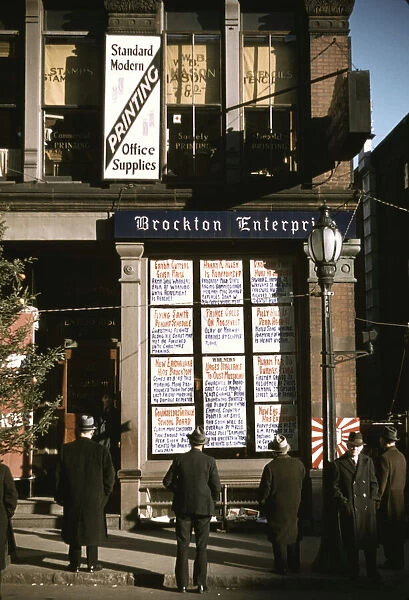 Men reading headlines posted in street-corner of Brockton Enterprise... office, Brockton, Mass. 1940 Creator: Jack Delano
