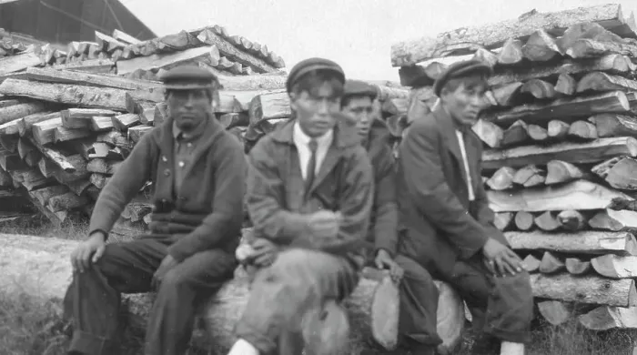Framed Print : Men sitting on logs, between c1900 and 1916. Creator: Unknown Framed Print : Men sitting on logs, between c1900 and 1916. Creator: Unknown