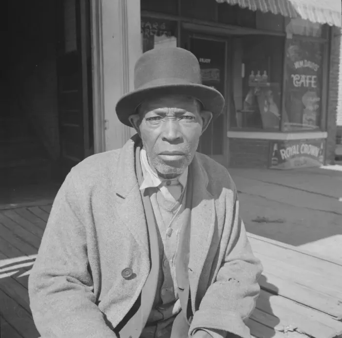 Framed Print : Men sitting in the sun on Sunday morning, Daytona Beach, Florida, 1943. Creator: Gordon Parks Framed Print : Men sitting in the sun on Sunday morning, Daytona Beach, Florida, 1943. Creator: Gordon Parks