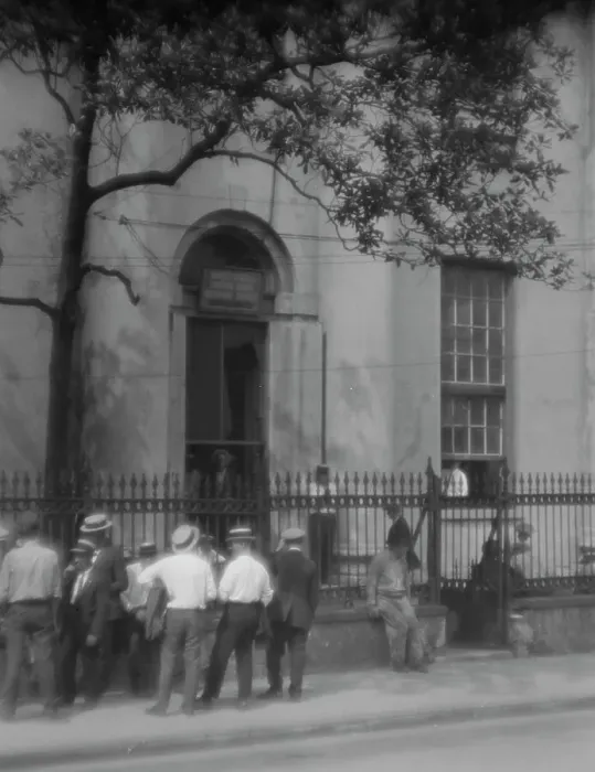 Framed Print : Men standing or sitting in front of the former Bank of Louisiana, 334 Royal Street... c1920-1926. Creator: Arnold Genthe Framed Print : Men standing or sitting in front of the former Bank of Louisiana, 334 Royal Street... c1920-1926. Creator: Arnold Genthe