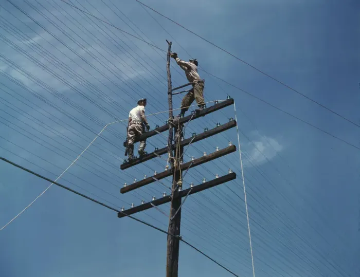 Framed Print : Men working on telephone lines, probably near a TVA dam hydroelectric plant, 1942. Creator: Alfred T Palmer Framed Print : Men working on telephone lines, probably near a TVA dam hydroelectric plant, 1942. Creator: Alfred T Palmer