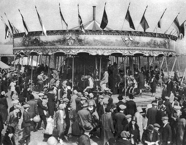 A merry-go-round, part of a bank holiday carnival on Hamstead Heath, London, 1926-1927