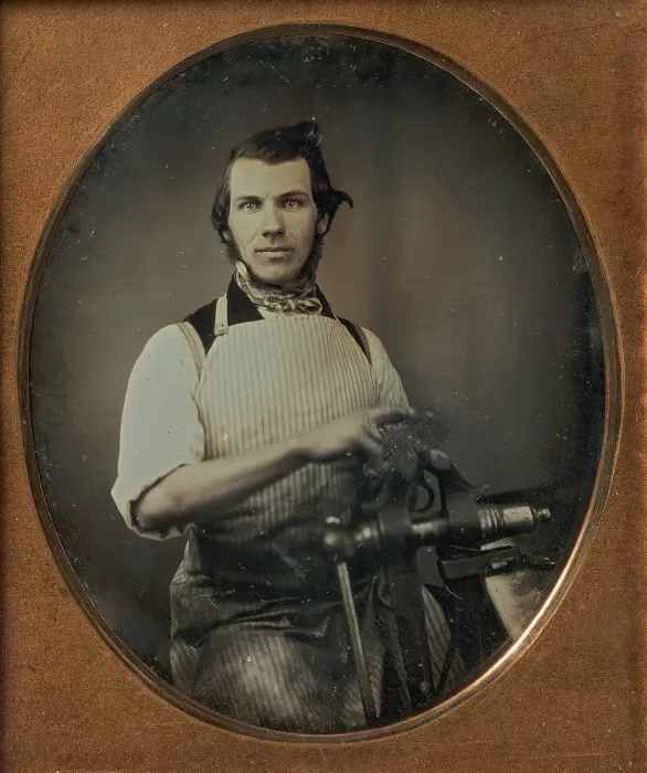 Framed Print : Metalworker in Apron Working with a Vise, 1840s-50s. Creator: Unknown Framed Print : Metalworker in Apron Working with a Vise, 1840s-50s. Creator: Unknown