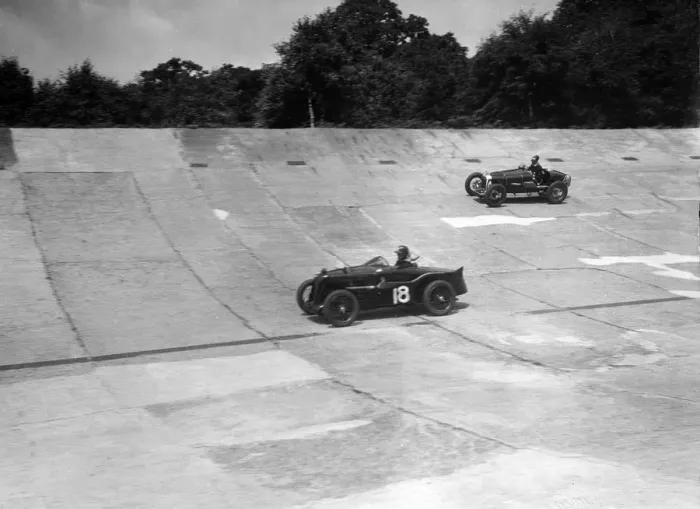Framed Print : MG C type and Amilcar C6 racing on the banking at Brooklands. Artist: Bill Brunell Framed Print : MG C type and Amilcar C6 racing on the banking at Brooklands. Artist: Bill Brunell