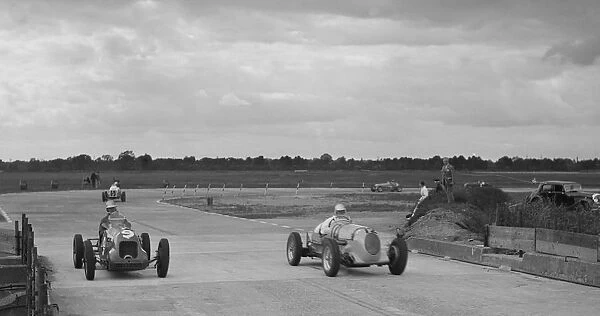 Two MGs racing at Brooklands, Surrey, c1930s. Artist: Bill Brunell