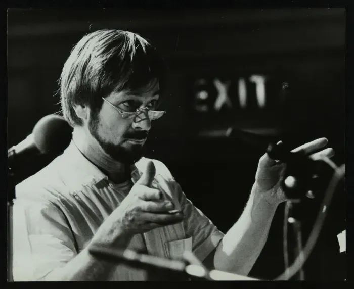 Framed Print : Michael Garrick conducting an orchestra at Berkhamsted Civic Centre, 1985. Artist