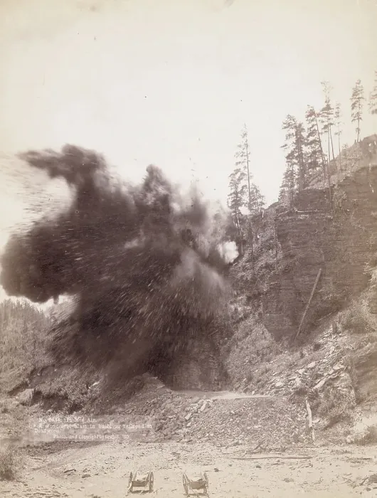Framed Print : In mid air A wonderful blast in building railroad to Deadwood, 1890. Creator: John C. H. Grabill Framed Print : In mid air A wonderful blast in building railroad to Deadwood, 1890. Creator: John C. H. Grabill
