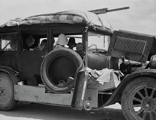 Migrant drought refugee family stalled on an Arizona highway, between Yuma and Phoenix, 1937. Creator: Dorothea Lange