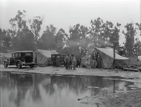 Migrant pea pickers camp in the rain, California, 1936. Creator: Dorothea Lange