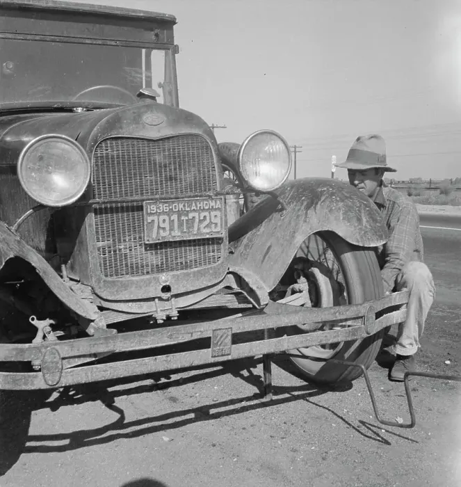 Framed Print : Migrant worker from Oklahoma repairing tire on California highway, 1936. Creator: Dorothea Lange Framed Print : Migrant worker from Oklahoma repairing tire on California highway, 1936. Creator: Dorothea Lange