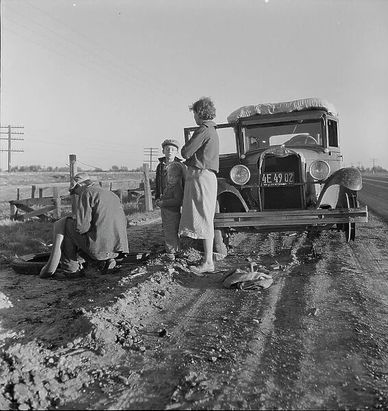 Migratory agricultrual worker family along California highway, U.S. 99, 1937. Creator: Dorothea Lange