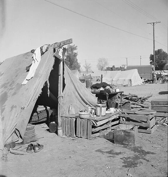 Migratory labor housing during carrot harvest, near Holtville, Imperial Valley, California, 1939. Creator: Dorothea Lange