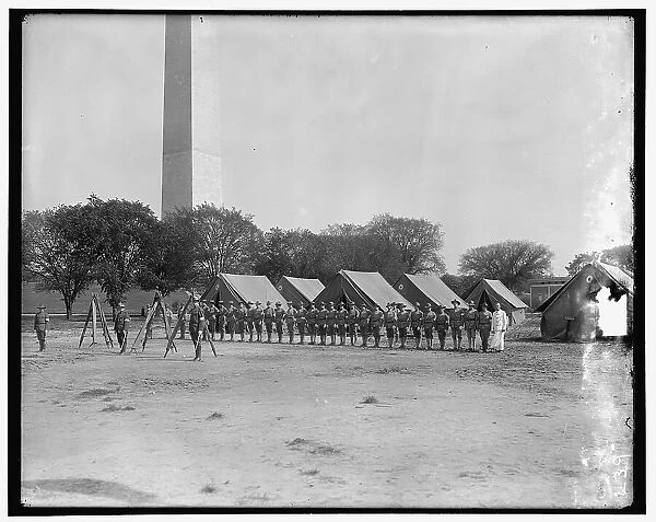 Military camp; base of Washington Monument, between 1910 and 1920. Creator: Harris & Ewing. Military camp; base of Washington Monument, between 1910 and 1920. Creator: Harris & Ewing